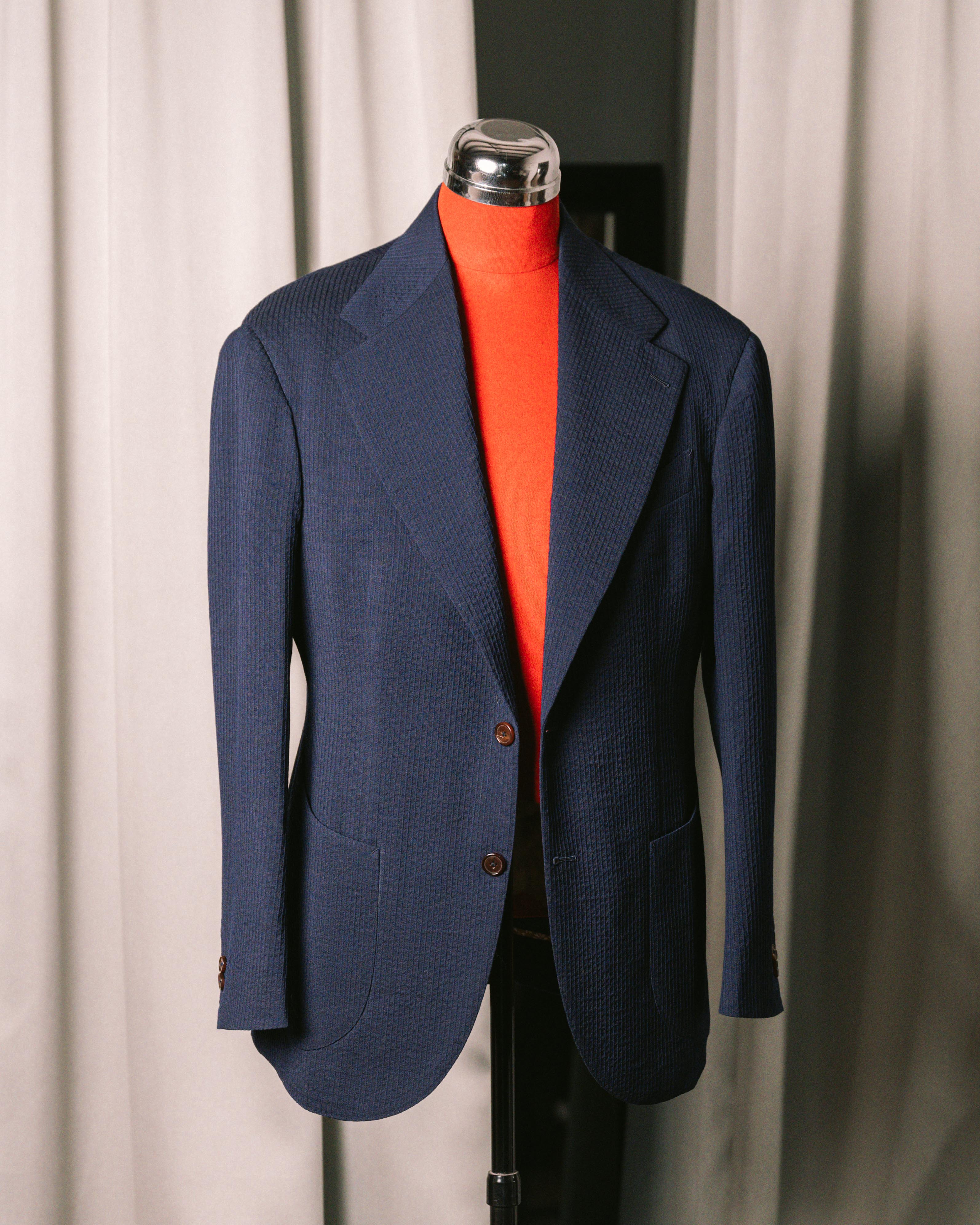 Navy Seersucker Jacket on a mannequin against a neutral background